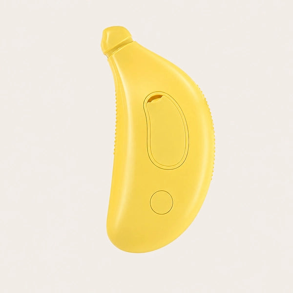 Yellow banana-shaped pet brush on a light gray background